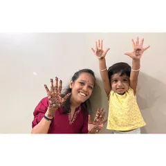 Another adorable shot of my niece showing off her festive mehendi.