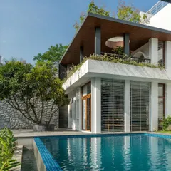 We designed the deck around this beautiful existing mango tree, creating a natural 'katte' or seating area by the pool. It’s a perfect example of building with nature, not against it.