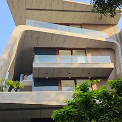 The fluid concrete forms of this residence are designed to feel organic and alive. Each level offers a different perspective, with cantilevered balconies that seem to float, creating a sense of lightness and movement.