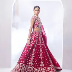 The movement and flow of this traditional red lehenga are captured perfectly here. The rich colour and detailed embroidery make it a bold and beautiful choice for the bride who wants to honour tradition with flair.