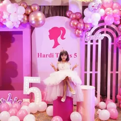 A dream come true for a little princess. This Barbie-themed 5th birthday party features a beautiful pink and white color palette, custom backdrops with the iconic Barbie silhouette, marquee lights, and elegant balloon garlands to make the birthday girl feel like royalty.