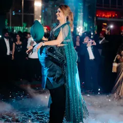 The couple's first dance. Her makeup is designed to be sweat-proof and long-lasting, looking flawless even on the dance floor.