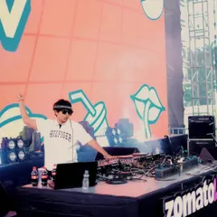 An action shot from my Zomaland set. Fist in the air, getting the crowd hyped. This is the energy I bring to every festival performance.