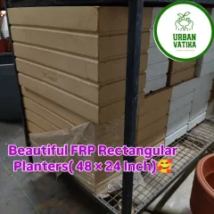 These are large FRP rectangular planters, 48 by 24 inches, stacked and ready for a big landscaping project. They are extremely durable.