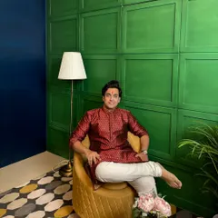 Dressed in a maroon silk kurta for a Gudi Padwa shoot. This image captures a regal and celebratory mood, ideal for brands targeting the festive season.