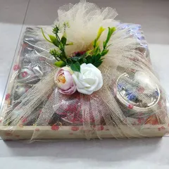 A fully wrapped wooden tray hamper, ready to be gifted.