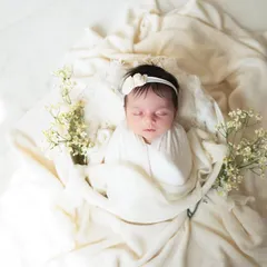 An overhead view of this classic white setup, showing the baby nestled safely in a bowl, looking like a precious pearl.