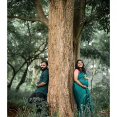 This image embodies our candid, nature-focused approach. We found a serene spot in a Bangalore forest, allowing the couple to relax and connect naturally, resulting in an authentic and peaceful maternity portrait.