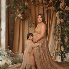 A candid and playful moment between a mother and her son during her maternity shoot. These genuine interactions make for the best memories.