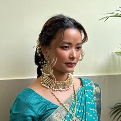 Another beautiful South Indian bridal look, featuring classic gold jewelry and a soft, elegant makeup application.