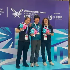 Our coaches lead by example. Here is our coach on the podium at the World Masters Games 2025, demonstrating the world-class talent that guides our students.