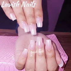 A clean and simple set of long, square-shaped nails with a sheer, natural pink overlay.