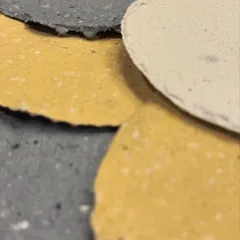 A close-up of the finished handmade paper. You can see the lovely texture and the soft, earthy colours achieved by adding natural dyes to the paper pulp.