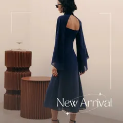 A look at the back of my signature Armani dress. The design features dramatic, flowing sleeves made from delicate organza and an open back, creating a sophisticated and modern statement for any special occasion.