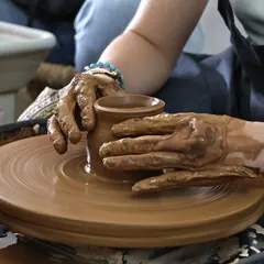 Feeling the clay spin under your hands is a kind of magic. It's all about finding your rhythm.