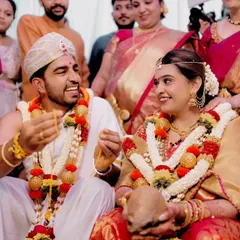 A candid shot of the bride and groom sharing a laugh during the ceremony. These unposed, in-between moments are often the most cherished memories.