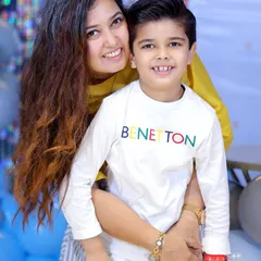 A warm hug between a mother and her son during his birthday photoshoot. These are the cherished family portraits that last a lifetime.