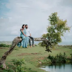 A creative pose during a pre-wedding shoot, using a unique tree branch over the water. I look for interesting natural elements to create visually striking and memorable pre-wedding photographs.