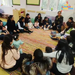 Circle time is a cornerstone of our Cuddle Bugs program. It's a time for songs, gentle movements, and social interaction, helping the littlest ones get comfortable in a group setting with their parent right beside them.