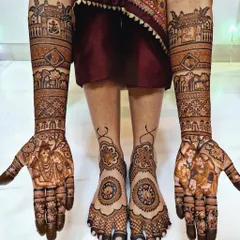 A complete bridal look, featuring coordinated, full-coverage mehndi on both hands and feet. We work with you to create a cohesive design that complements your entire wedding attire.