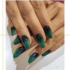 A different angle of the emerald ombre nails, showcasing the rich color depth and flawless glossy finish that makes this design so captivating.