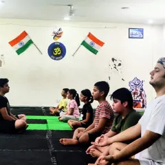 Pranayama (breathwork) is a key part of our training. It increases lung capacity, boosts immunity, and sharpens concentration, making our students calmer and more focused.
