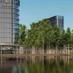 We believe in integrating our buildings with the natural landscape. This view of the Bagmane tech campus shows how the curved glass facade reflects the surrounding trees and water, creating a harmonious relationship between the built and natural environments.
