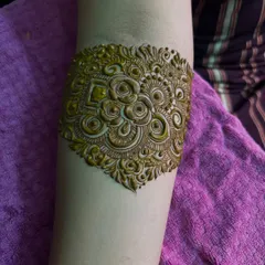 A close-up of the armband portion of the design. The details are incredibly fine, with delicate swirls and floral motifs.