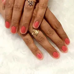 A simple gel polish can never go wrong. This is a beautiful, clean manicure in a lovely coral-pink shade, perfect for a fresh and polished look.