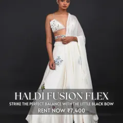 For a modern Haldi look, we suggest this 'Haldi Fusion Flex' outfit. The white lehenga with a bralette-style top and delicate floral embroidery offers a fresh and stylish alternative to traditional yellow.