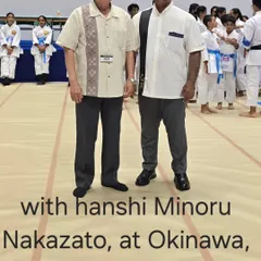 Standing with Hanshi Minoru Nakazato at a tournament in Okinawa, Japan. His guidance is invaluable in maintaining the high standards of Shorin-ryu Shorinkan in India.