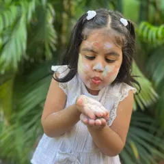 Blowing away the colourful, natural clay powder. My Holi colours are so fine and soft, making them fun and safe for everyone to play with.