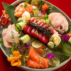 This shot demonstrates our expertise in high-end food styling and photography. We meticulously arranged this vibrant sashimi platter on a bed of ice with edible flowers to create a visually stunning image for a fine-dining Asian restaurant.