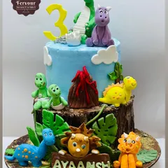 A roaring success, this dinosaur-themed cake is filled with hand-crafted, friendly dinosaurs and a volcano. The different textures of the log base and the blue sky make it a visually exciting centerpiece for a 3rd birthday.