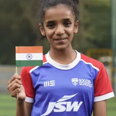 Another proud young player celebrating Independence Day. Our program is an inclusive space for girls to develop their passion for football.