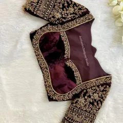 The back of the velvet blouse, showing the intricate embroidery and a stylish cutout.