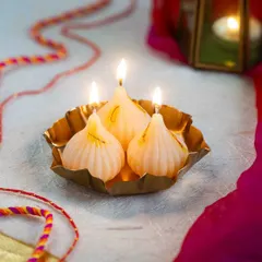 Here are my modak candles, all lit up and glowing. They look so beautiful in a traditional brass plate and are perfect for your Ganesh Chaturthi or Diwali pooja.