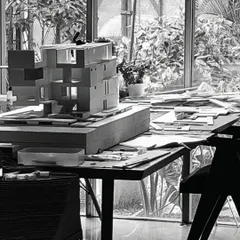 A work-in-progress model on the studio table, surrounded by the tools and materials of its creation. Our studio is a workshop where ideas are constantly being built, tested, and refined.