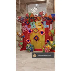 For a fun and folksy theme, I used colorful Rajasthani umbrellas and fabric hangings to create this backdrop. It's a very lively and unique setup for a Mehendi or Sangeet party.
