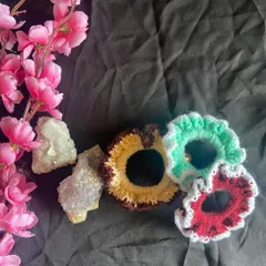 Another group shot of the crochet hair ties. I use a durable elastic inside so they have a good stretch but also hold your hair securely. You can order a single scrunchie or a custom set.
