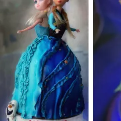Another angle of the Frozen cake, highlighting the contrasting blue tones of the sisters' dresses.