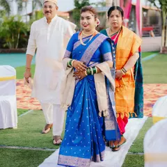 The bride's grand entrance, walking down the aisle with her parents. I focus on capturing the significance and emotion of this moment.