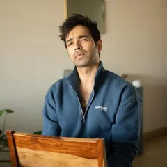 A straightforward, seated portrait that feels both casual and professional. This type of shot is essential for a versatile acting portfolio.