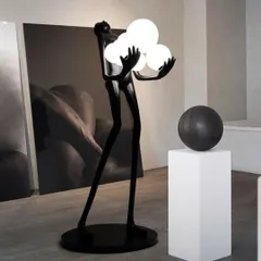 This floor lamp showcases a dynamic human form crafted from high-quality fiberglass resin, holding a trio of glowing orbs. It is a perfect example of how we merge sculpture with LED technology to create dramatic, artistic lighting.