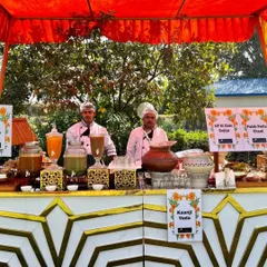 A vibrant chaat and drinks counter set up for a sunny Holi party. I offered traditional drinks like Kaanji Vada and a variety of chaats like UP ki Dahi Gujiya to celebrate the festival of colours.