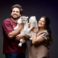 We're happy to include your fur babies in your session. This couple's portrait with their two beautiful cats is a perfect example of a full family photo.