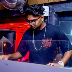 Focused on the mix at The Gypsy Pub. I blend different genres seamlessly, from hip-hop to pop, ensuring the music flows perfectly throughout the night.