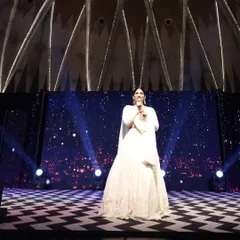 A full view of the stage and me during a Sangeet. I am experienced in hosting on grand stages, making sure every guest feels like part of the celebration.