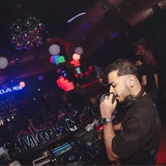 On the mic at Toy Room, making sure the energy level never drops.