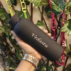 A sleek, matte black temperature bottle engraved with the name "Vedastu". The minimalist design and clean engraving make this a very popular and sophisticated gift choice.